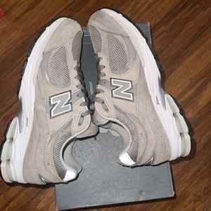 White and gray new balance 2002r